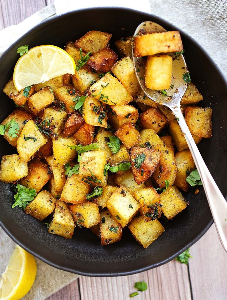 Spiced potatoes on plate.
