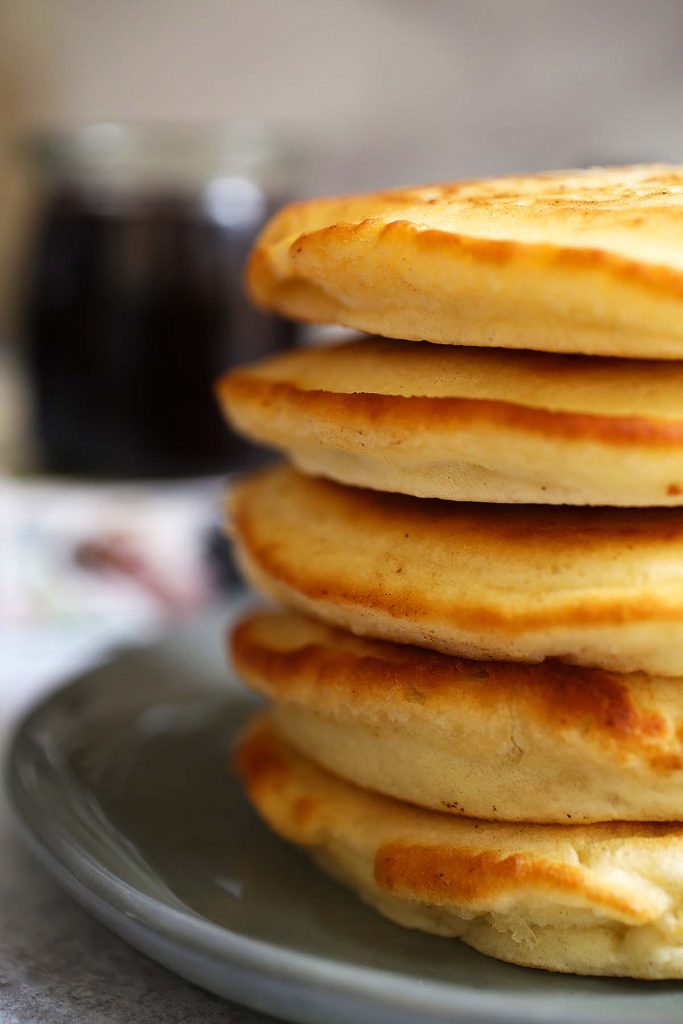 Stack of pancakes on a plate.