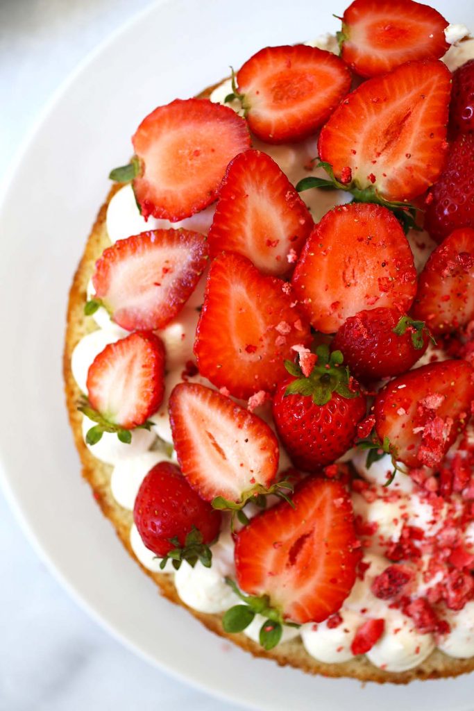 Strawberry cream cake on plate.