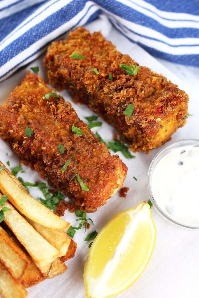 Fish fingers with lemon wedge.