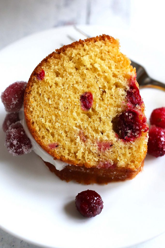 Cranberry orange cake with sugared cranberries.