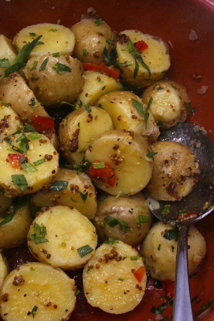 Boiled potato salad with fresh chopped herbs.