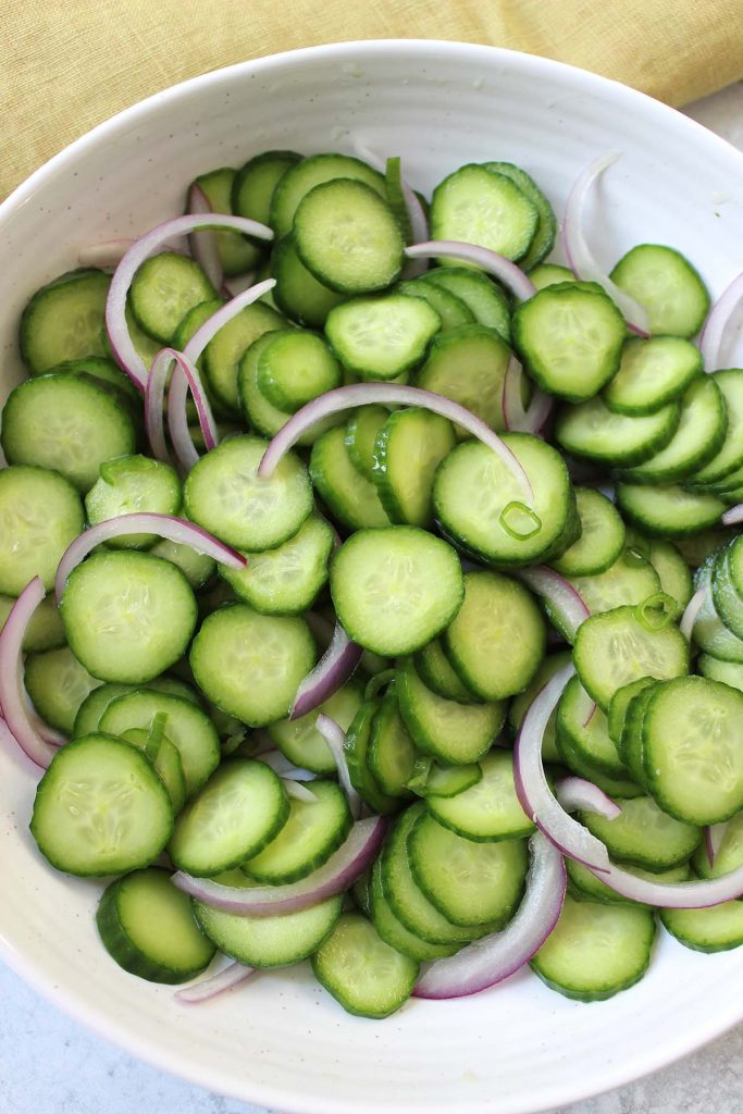 Cucumber and onions salad in a bowl. 