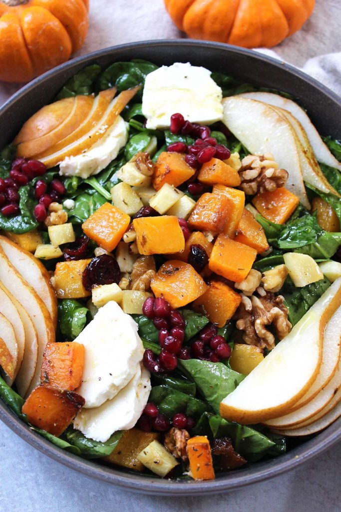 Fall salad with greens, roasted pumpkin, pears, cheese and walnuts.